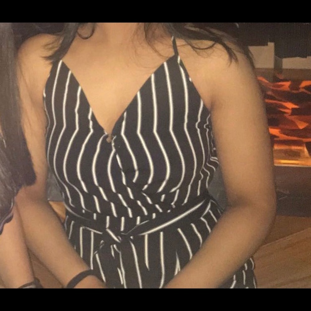 black jumpsuit with white stripes